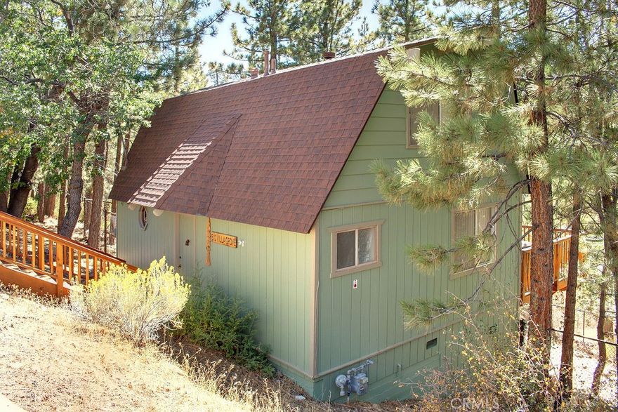 You’ll love the quiet ambiance & large newer deck to take in the oak & pine tree setting from this well kept Moonridge retreat.  T&G wood beamed ceilings throughout.  Cozy brick fireplace.  Large eat-in kitchen w/ built-in corner storage.  4 ceiling fans.  Spacious bedrooms w/ vaulted ceilings.  Bonus ½ bath upstairs.  Large fenced lot, great for pets.  Will come mostly furnished and ready to go!!