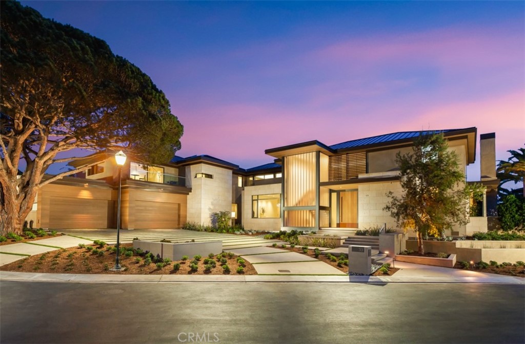 Among the finest trophy estates to be publicly offered along the California Coastline, this newly reimagined and reconstructed Legacy estate is championed behind the ultra-exclusive gated enclave of Smithcliffs, sited on an expansive, front row bluff-front parcel spanning over half an acre. Completed in 2021, 33 Smithcliffs is ideally situated to optimize the unparalleled views of the Pacific Ocean’s sparkling waters, Catalina Island’s rolling cliff-sides, and the coastline’s roaring white-water, nearly every room from the home enjoys this surreal backdrop. The newly constructed estate is a collaborative effort with creative architectural mastermind Carlton Graham, exceptional design elements by Michael Fullen, and unparalleled craftsmanship by Hill Construction; this property sets an unprecedented high standard for warm, modern, interior design through its careful selection of the richest materials, lustrous textures, and serene patterns. Boasting ~10,000ft of newly designed, on-grade living space, the entrance delivers a magnificent first impression thanks to soaring ceiling heights characterized by 20 foot high, motorized pocketing doors that seamlessly weave the indoor & outdoor living spaces together. A gourmet chef’s kitchen, highlighted by professional grade Miele appliances, exquisite custom cabinetry, full secondary prep kitchen, lies adjacent to the family room, which is complemented by delicately book-matched natural stone fireplace wall, incredible sit-down ocean and coastline views, and an abundance of natural light that permeates every corner of the interior. The 6 bedroom, 9 bath residence is generously appointed with a main-floor master suite, featuring a spa like master bath with steam shower and heated floors, dual walk-in closets with custom built-ins; gym, library, elevator, walk in glass-encased wine cellar, 6 car garage, awe-inspiring unobstructed ocean views from nearly every room, and an expansive ~1800ft sunbathing ocean view roof-deck, providing a level of accommodation rivaling the world’s best resort destinations. A property unlike any other, this once-in-a-lifetime opportunity to own this generational treasure is a dream brought to life. Timeless. Irreplaceable. 33 Smithcliffs.