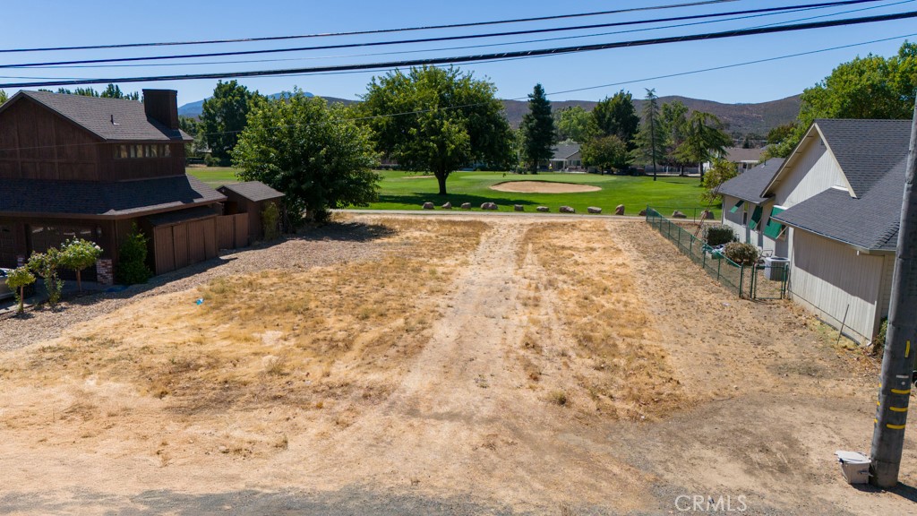 Experience the ultimate in golf course living in the gated community of Hidden Valley Lake! This spacious lot is level and comes ready with water and sewer hookups available, offering the perfect spot to build your dream home. Hidden Valley Lake is a haven of amenities, including a stunning 102-acre lake with two white sandy beaches. Big Beach features BBQ pits, picnic tables, swings, a volleyball court, and two large diving rafts, while Little Beach provides a playground and easy kayak access for younger adventurers. Enjoy the seasonal swimming pool, open from May to September, with options for swim lessons, lap swimming, or just relaxing on a comfortable lounge chair. Hidden Valley Lake also offers 24-hour security, a marina, tennis and pickle ball courts, fishing docks, a dog beach, an equestrian center, and an 18-hole professional golf course. Ravenhill Park includes a playground with basketball courts and playing fields. The Campground features 66 campsites (17 with RV hookups) and is located next to a park and little league baseball field. Association dues $235.50 per month and CC&Rs apply. Just 2 hours north of San Francisco, 1 hour from Santa Rosa, and 30 miles north of Calistoga, this is your opportunity to enjoy an extraordinary lifestyle in an ideal location.