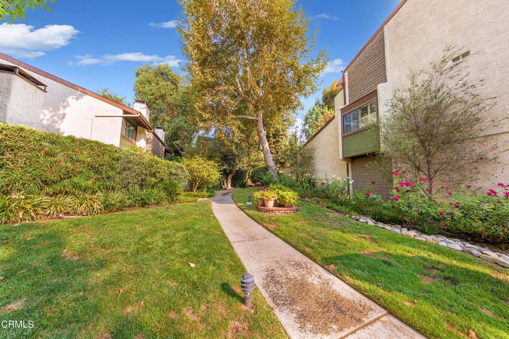 This spacious, move-in ready townhome is located in the coveted, beautifully landscaped Franciscan Woods Community just a block away from Garfield Park and less than 1 mile from the Marengo Elementary School as well as being close to many popular stores and restaurants in desirable South Pasadena. The home features 3BR, 2BA, a newly remodeled kitchen with new appliances and remodeled bathrooms with quartz counters and plenty of storage, central air & heat, a whole house water filtration system, a lovely wood/gas fireplace in the bright living room, and sliding doors that open to the large outdoor patio space, perfect for entertaining! The dining room overlooks the living room to create an open floor plan and there's a breakfast nook area in the kitchen with 3 barstools. The master bedroom and bathroom are upstairs, along with the converted 3rd bedroom, which has a vaulted ceiling, a large closet and a sliding glass door that opens onto a balcony that overlooks the beautiful, mature, trees. The dependable HOA maintains the grounds and tends to the heated, community pool that is surrounded by greenery and features plenty of seating, a cabana, outdoor grill, utility sink, and clubhouse. Enjoy your weekends in a tranquil space! The 2-car attached garage offers easy, direct access into the townhouse. A treasured find, come envision your new beginning while it's still available!