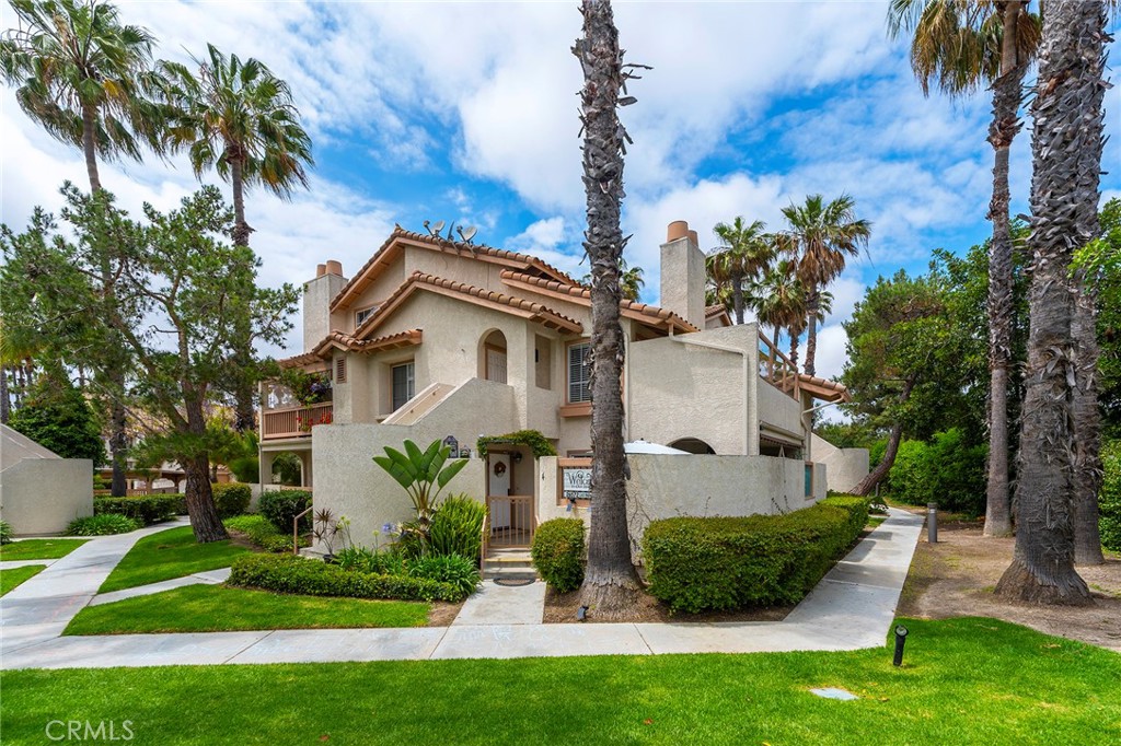 Welcome to this stunning and extensively upgraded two-bedroom, two-bath home located in the highly sought-after Briosa community. Prepare to be enchanted by the seamless blend of indoor and outdoor living as this home showcases a captivating wrap-around private patio. The residence is bathed in abundant natural light, creating an inviting and cheerful atmosphere. Overlooking a spacious and predominantly secluded greenbelt, this home provides a serene backdrop for your morning routine, whether it involves enjoying a leisurely stroll with your furry friend or savoring a cup of coffee. As you step inside, you'll immediately notice the tasteful enhancements that have been made. Luxurious vinyl plank floors, and modern kitchen updates, including a stylish backsplash and beautiful countertops, elevate the home's aesthetic appeal. The well-appointed kitchen features stainless steel appliances, a newer sink, and recessed lighting throughout. The home boasts a natural color palette and a fresh interior paint scheme, while a cozy fireplace in the living area adds to the overall sense of tranquility. The generous master bedroom includes a sizable walk-in closet, and the bathrooms have been thoughtfully upgraded, creating an additional sense of space and elegance. Central air conditioning ensures comfort during warm summer nights, and the upgraded kitchen opens up to the dining and family room areas, facilitating seamless interaction and effortless entertaining. The living room features a gas fireplace with a charming vinyl tile façade, further enhancing the warm and welcoming ambiance. The sliding glass door provides an ideal setting for outdoor gatherings, barbecues, or simply enjoying pleasant evenings. Both inside and out, there is ample space for entertaining guests or accommodating pets. Convenience is paramount, with a stackable washer/dryer conveniently located within the unit. In addition to garage parking, there is permit parking and plenty of unassigned/guest spaces. The community itself boasts a pool, spa, and a greenbelt, playground, ensuring ample opportunities for relaxation and recreation. The location is ideal, with close proximity to shopping centers, freeways, and a wide array of dining options. HOA dues cover trash/water. Community benefits from a private park featuring a playground and basketball court, along with an additional pool and spa. This is your incredible opportunity to enjoy a truly harmonious and convenient lifestyle.