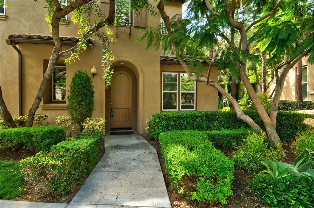 This beautiful Quail Hill Detached TWO STORY Home Features 3 bd/2.5ba PLUS Large Loft AND Large Den at the main level! Upgraded ceramic tile and ELEGANT distressed wide plank hardwood laminate flooring (NO carpet!) Gourmet kitchen opens to family room with cozy fireplace and manicured enclosed patio! UPGRADED Energy saving ceiling fans in every bedroom and family room, plus pre-wired for surround sound in family room. Relax in a luxurious soaking tub in the master bathroom! Washer and dryer included! Enjoy nearby resort style amenities including private fitness center, pools, spas, parks and tennis plus the Award Winning schools, Alderwood, Rancho San Joaquin and University High! Also close to the fantastic Irvine Spectrum Shopping and Entertainment Center!