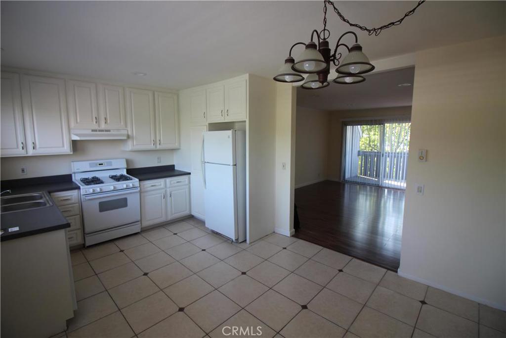 Beautiful upgraded upper level home with 3 bed 2 bath. Enter into spacious living room with NEW Pergo floor and recessed lights. Remodeled BIG eat-in kitchen with NEW Counter, and bathrooms with NEW vanity. FRESHLY PAINTED interior and scraped ceilings. Spacious Patio with lock up storage, 1 car carport. Woodbridge is one of Irvine most sought after neighborhoods with 2 beautiful lakes for fishing and boating, award winning schools, lots of green areas, 2 beach lagoons and over 24 pools 16 spas, 24 tennis courts numerous parks with play equipment. NEW park, pool and playground around the corner.