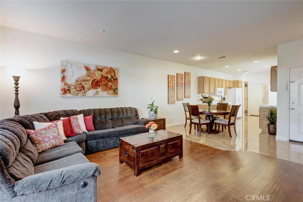This beautiful dual-master suite home sits in the lovely gated community of Orleans, and offers an open floorplan, a private patio, a community pool and spa, and an attached two-car garage. The kitchen has gorgeous porcelain tile floors, plenty of cabinets and counter space, recessed lighting, and lots of windows for added light. The kitchen opens to the dining nook and family room, which feature beautiful wood laminate floors and a fireplace. Upstairs are dual masters, with two spacious bedrooms that include brand new carpet, mirrored wardrobe doors, and private en suite bathrooms. This home was recently repiped with Pex, and is just steps from the association pool and spa. This lovely home sits in a quiet, gated community that is walking distance to award-winning schools, hiking and biking trails, and beautiful parks, and is just a short drive to shopping and theaters, the toll road, and Laguna Beach!