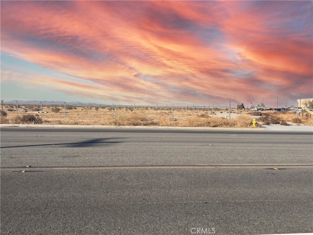 Adelanto Industrial Land Offering. ±3.22 acres of vacant land zoned MI. The Manufacturing/Industrial (MI) district provides for a wide range of industrial uses, including light and heavy industrial and manufacturing uses. Adult businesses as well as certain cannabis related businesses are also conditionally permitted within this zoning district. This site fronts along a paved frontage road with curb and gutter already in place. There are two existing curb cuts allowing immediate access to this parcel from Rancho Rd. Immediately adjacent to the west of The San Bernardino County Human Services office building. Electricity and water are present in the street or adjacent to the parcel. Well situated in the Adelanto Industrial Park region just 1.4 miles west of Hwy 395. Excellent opportunity for future development.