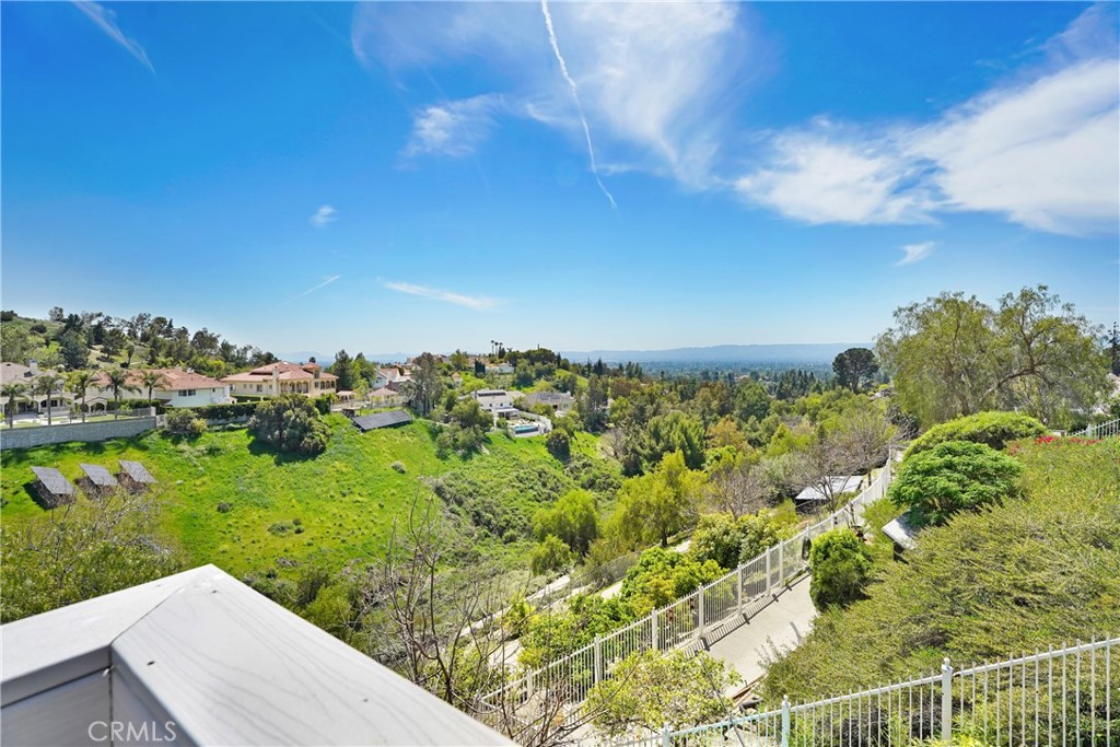 Welcome to 12112 Nugent Drive, Granada Hills! Nestled in one of the most prestigious areas of Granada Hills, this tastefully updated home offers an incredible blend of style, comfort, and breathtaking views. Featuring 5 bedrooms and 3 bathrooms with over 2,800 sq ft of living space, this property is ideal for both entertaining and everyday living. Step inside to find a freshly repainted interior with an inviting floor plan designed to capture natural light and serene views from nearly every room. The spacious living and dining areas flow effortlessly, while a bedroom/office conveniently located downstairs offers flexibility for guests, work-from-home needs, or multi-generational living. The home boasts brand new garage doors and motors, sleek new epoxy floors, and a large outdoor deck perfect for gatherings or peaceful mornings with city and nature views all around. Several bedrooms offer stunning views as well, making this a true retreat. Whether hosting guests or enjoying quiet nights at home, this property provides the perfect setting. Ideally located close to freeways, popular markets, dining, and top-rated schools, this home truly checks all the boxes. Don’t miss your chance to call this Granada Hills gem your own!