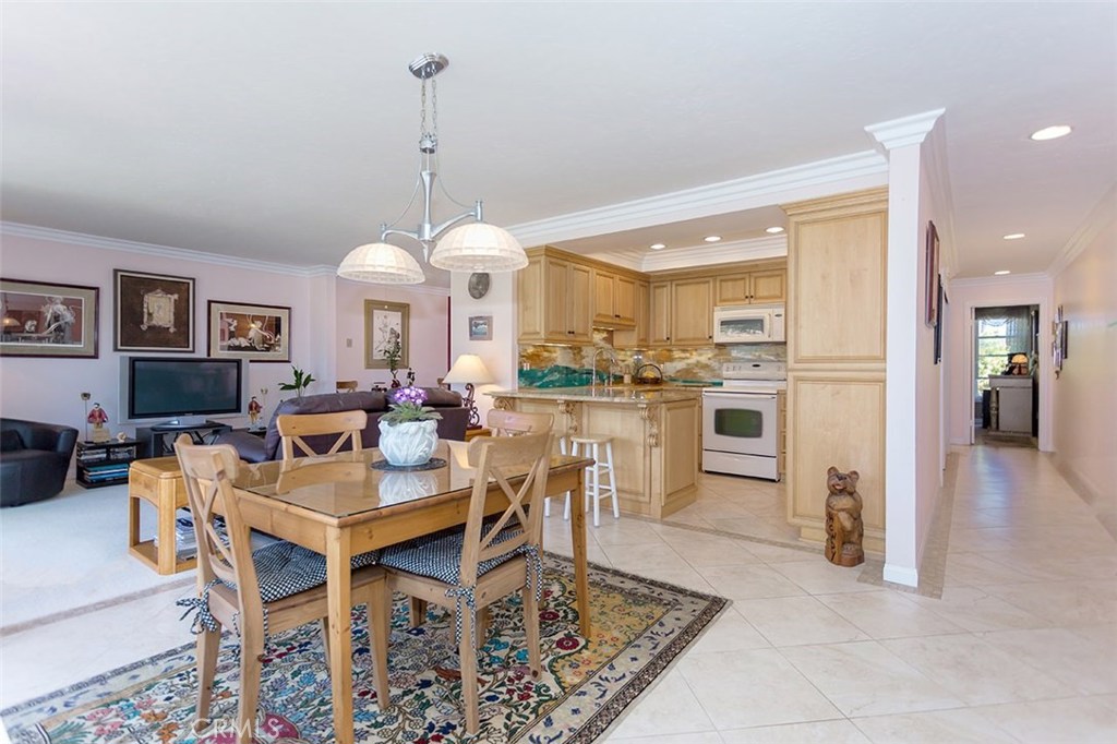 This condominium is a "Rare Find"- the units in this project "rarely" come up for sale.. This condominium has 2 Bedrooms, with a den, and 2 Bathrooms This upstairs condominium is in a project that is located on the bluff, overlooking the Dana Point Harbor...see photos..The property is on the 2nd level, and has a recently updated kitchen - with newer cabinets with self closing doors and drawers, Granite Counter top, updated sink with reverse osmosis water filtration, appliances include an oven, dishwasher, and microwave oven. There is lighting under the cabinets, with 2 "lazy-susans" for easy access.
The deck faces the open courtyard, the courtyard and greenbelt overlooks Dana Point Harbor. The deck also has a laundry closet with washer and dryer hook-ups. Parking is subterranean with 2 spaces, at the street level, there are spaces for guest parking.