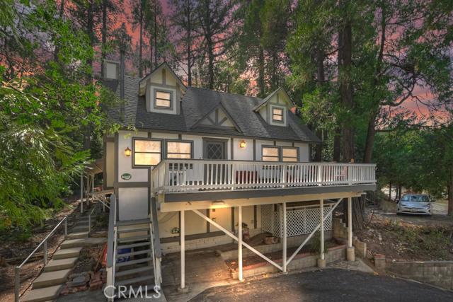 Beautifully remodeled Bavarian home with tudor style exterior nestled amongst the trees and seasonal creek. Home has three levels to it. The main level entry opens to the living room with fireplace, master bedroom & bathroom, dining area, and recently renovated kitchen. The staircase leads to two more bedrooms with tree top views and a bathroom. The lowest level of the home is a workshop and laundry area. This home also has plenty of outdoor space with the backyard area and entertaining deck off the living room. Many aspects of the home were remodeled in 2020.