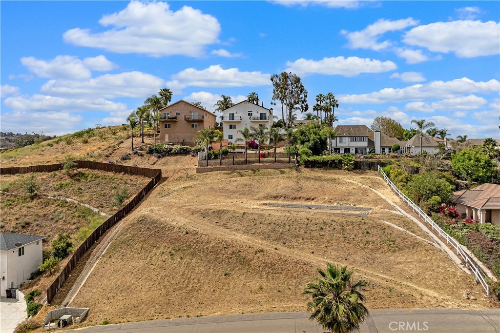 BREATHTAKING VACANT LAND WITH PANORAMIC VIEWS - Discover your dream property with this exceptional vacant land offering stunning
panoramic views! Nestled in a serene and sought-after location in the Canyon Ridge Hills area of Woodcrest in Riverside, this expansive lot
provides a perfect canvas for your custom-built home or investment project. The lot size is 24,829 square feet (.57 acre) and measures
approximately 149' by 168'. The lot is partially fenced. There are amazing views from many different angles. There appears to be water and
electricity on-site. There is a septic tank installed on the property and the lot has been rough graded. The nearby neighborhood has higher-end
custom homes. Enjoy the tranquility of a rural area while being conveniently close to local amenities, shopping, schools, recreational activities,
and freeways. With ample space and endless possibilities, this prime piece of real estate is a rare find. The yellow marked boundary lines are
approximate and for illustrative purposes only.