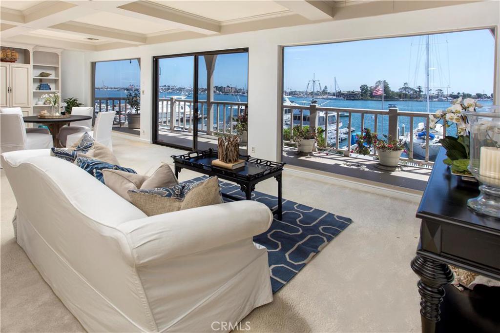 Offering incomparable bay views, this is possibly a once in a lifetime opportunity to create your dream estate on the gold coast of Newport's highly coveted and prestigious gated community of Harbor Island. The extraordinary main channel and anchor basin vistas feature all the activities up and down the bay from beyond the Pavillion to Lido Isle making this a true trophy property! Southwestern exposure allows for just the right amount of sun all day and breathtaking sunsets in the evening. And unique to most bay front properties there is also a spacious waterfront terrace and lawn ideal for entertaining large groups or just enjoying your own private sanctuary. Although the existing home is older, it is certainly a warm and inviting place to remodel or live in while you plan for the home of your dreams. Park your large yacht right in front, but you may never want to leave!