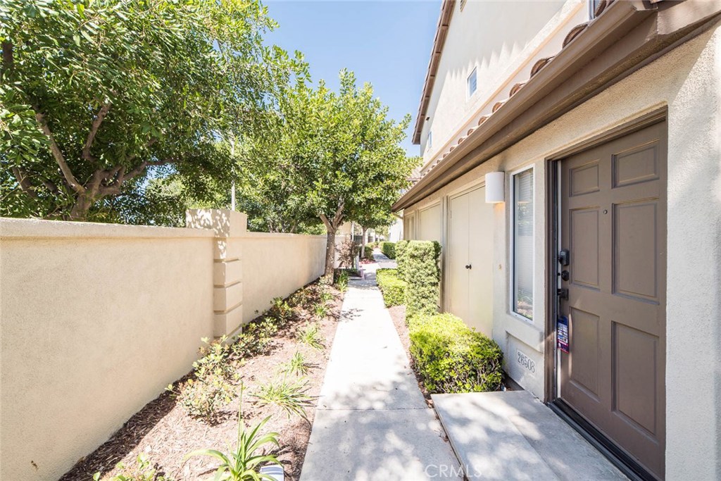 Beautiful move-in perfect carriage style condo in upscale Mission Viejo area! 2 Bedrooms, 2 baths, direct garage access, cathedral ceilings, fireplace, large patio, inside laundry and attached garage. Walk to top ranked Bathgate Elementary school, 4 neighborhood parks, walking trails, canyons & new Mission Viejo Shuttle stop! Washer, dryer included. Will include refrigerator if requested.