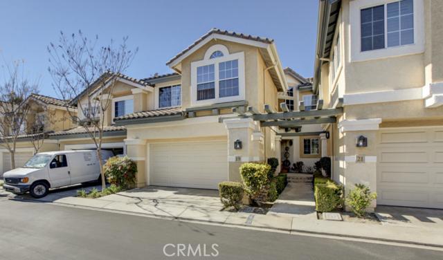 Immaculate 3 bedroom, 2 and a half bath in the pestigious Mirasol Gated Community features vaulted cathedral ceilings, custom walk-in master closet, custom draperies throughout, custom storage area under stairs, lots of storage throughout, lots of built in garage storage, ceiling fans in all bedrooms, tranquil water fountain in yard, automatic sprinkler and drip system in back yard that backs up to wildlife sanctuary, pass through fireplace and stainless steel appliances. Original owner has kept this property meticulous. The Marisol Community is beautifully manicured and centrally located to shops, dining, dog park and freeway.