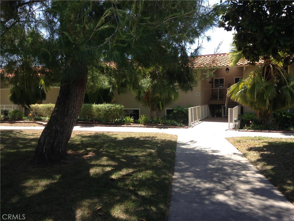 This 2 bedroom 2 bath Castilla has 9 steps to the front door. Light and bright with laminate floor in hallways and kitchen area. Needs carpet and paint.