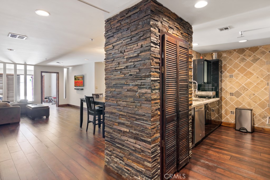 Welcome to a perfectly located first floor condo unit in a newer mid-rise building. Special floor plan includes an extra room attached to the living room which could be an office, entertainment room or guest bedroom perhaps. This room has direct access to a large exterior outdoor shared court yard. Wood floors, upgraded Chef’s kitchen appliances and cabinetry and recessed lighting throughout. Walk-in closet and unique spa-like bathroom with walk-in shower. Only 4 blocks from the ocean, the location is walking distance to Third Street Promenade, Farmers Market, Santa Monica Pier and Ferris wheel and Montana Street! Subterranean ONE secure parking space. Roosevelt school district too.
