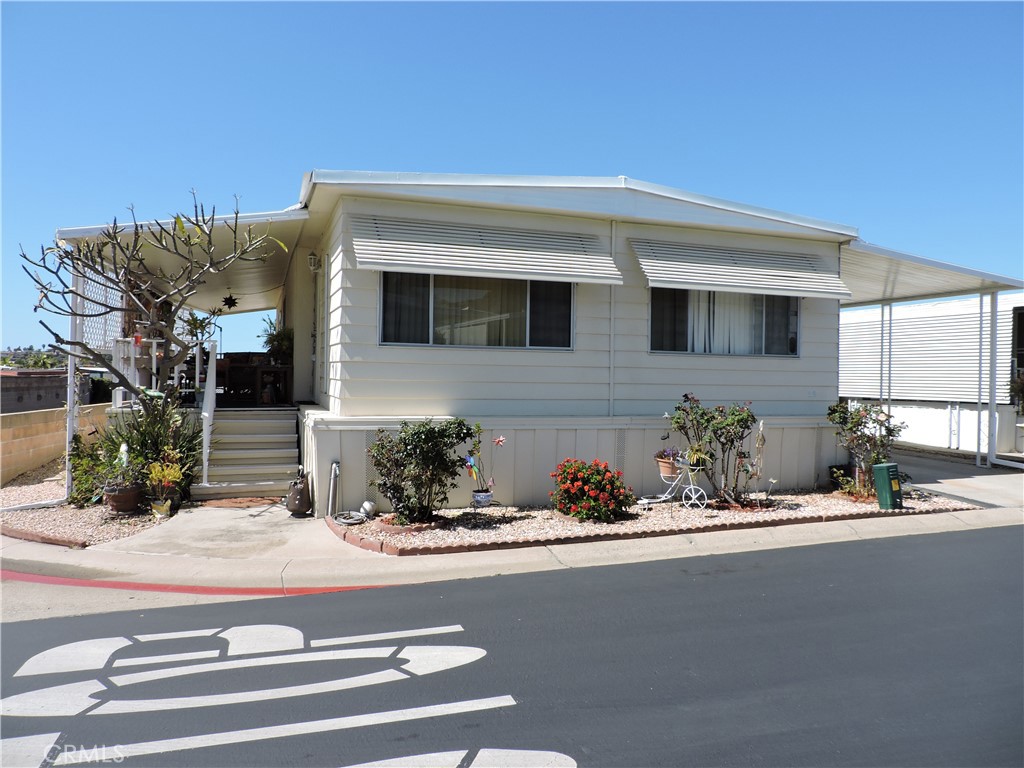 Charming & Affordable Manufactured Home in Vista!
Welcome to 1506 Oak Dr. #34, a beautifully maintained 2 bed, 2 bath manufactured home in the desirable Vista Village. This inviting residence offers a spacious corner lot with street views, providing both comfort and convenience. The outside car port can accommodate up to 3 vehicles. On the other side of the home is a private patio that is perfect for relaxing or entertaining.
Enjoy an open-concept living space with kitchen and dining room. The master bedroom contains a walk-in closet and its own bathroom while the second bedroom is right next to its bathroom in the hallway.
As part of a well-kept community, you’ll benefit from a low HOA fee of just $355/month, which covers trash, water, internet, and basic cable, making this home an incredible value! Conveniently located near shopping, dining, freeway access, and local parks, this home is perfect for those seeking affordability without sacrificing quality.