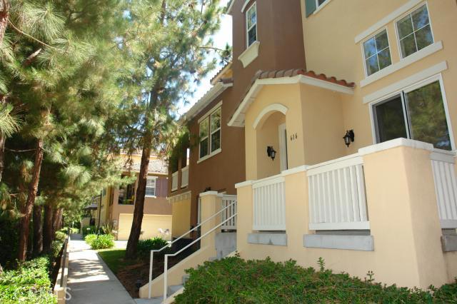 Beautiful tri-level condo in the Northwood newer gated community of Collage. Corner Unit, with lots of natural light. Private interior location within community. Unique and versatile floor plan. The Living Room open to Front Patio Deck and also features a lovely Fireplace with mantel. Kitchen with cozy Breakfast Bar, is open to the Family Room and has an arched doorway to the Dining Area. Dining Area overlooks Living Room. Upstairs features dual Master Suites with Walk-In Closets, and closet organizers. Association Amenities include pool and spa. Direct access Two Car Garage with additional built in storage. Attend award winning Northwood High and Canyon View Elementary.