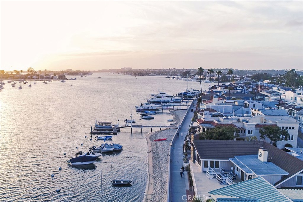 Spectacular opportunity to own a rare corner DOUBLE LOT on sought-after South Bayfront. Located on the desirable quiet end of Balboa Island, this property offers a truly unique and special chance to own one of the most dynamic pieces of real estate in all of Newport Harbor. Resting on a select corner, this massive parcel, which can be subdivided according to the City of Newport Beach, is ideally situated to afford a new owner the opportunity to build two new custom homes or one large estate with the best views in Newport Beach. The current structure is comprised of five units, including a large
two bedroom “penthouse” unit upstairs, along with four additional one-bedroom units below. The picturesque location would allow the new structure(s) to capture stunning vistas of the Turning Basin, Peninsula, Pavilion, and much more. This property is one of the most uncommon finds to hit the Island market in years. Don’t miss out.