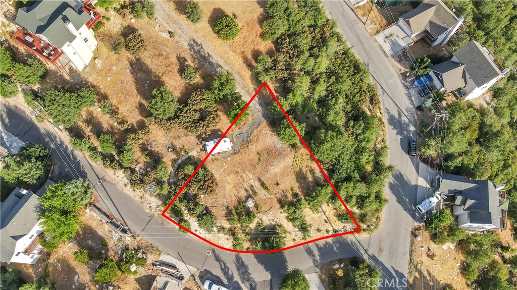 ** Lake Rights ** Don't miss this exceptional opportunity to acquire a scenic lot in the coveted Arrowhead Woods area of Lake Arrowhead, CA! This parcel comes with valuable water rights to the lake and is fully prepared for construction, boasting readily available utilities right at the lot. Spanning a generous 8,600 square feet, this spacious lot covers 1/5 of an acre. The property offers dual access options, accessible from your private cul-de-sac and Modoc Ln. Several outstanding features make this lot stand out, including a level building pad that's primed for construction. The land has already been cleared, eliminating the need to remove any trees. With the right architectural plans, you can enjoy picturesque views of Grass Valley Lake. This community offers an array of privileges, including Lake Rights, the freedom to use your own boat, access to local parks, and the use of the Lake Arrowhead lake. The lot is equipped with sewer, water, gas, phone, cable TV, and internet connections conveniently available on the street. Whether you're an owner-user or a builder with dreams of creating your ideal home, this lot is the perfect canvas for your vision. Don't let this opportunity slip away!