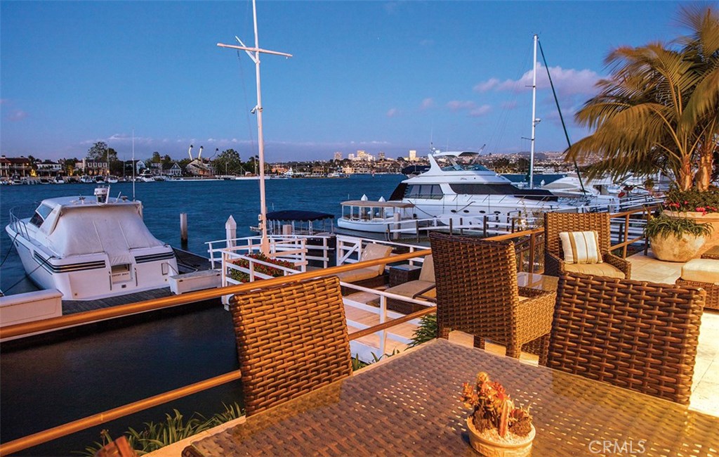 Situated on the premiere waterfront avenue of Newport Beach’s coveted Lido Isle this recently remodeled 3-bedroom suite 3.5-bathroom home epitomizes southern California coastal living in every way. The approx. 3980 sqft home follows soft contemporary design notes, bay facing living room & dining room, gourmet kitchen and 3 car garages. Second floor hosts a master retreat spanning the 40ft bay facing side, two secondary bedroom suites and media center. Outside premium stone hardscapes and beautiful landscapes accent the waterfront deck, dock, and built in BBQ all in the backdrop of Newport Harbor and city lights with the saddleback mountains resting in the horizon. Positioned on the main channel offers deep water allowing perfect accommodations for a wide range of sea vessels. The vibrant and recently renovated surrounding community showcases premium shopping, dining and entertainment. This rare location and pristine condition can only be appreciated in person.