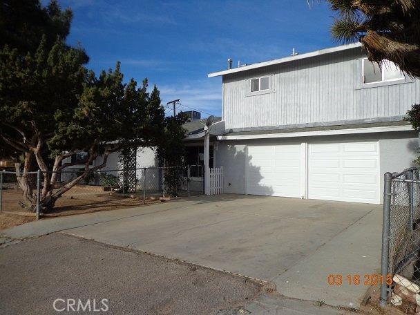Two Units. Great opportunity live in one and rent the second unit. Freshly painted interior, new carpet, new HVAC unit for unit 2, new garage roll up doors, new freestanding range & dishwasher. Unit one includes 2 bedrooms/2 bathrooms, nook area, & family room. Unit 2 includes 3 bedrooms, 3 bathrooms, family room, nook, & loft. One car garage for each unit. Fenced yard & located on corner lot. Association Amenities: None # of RV Spaces: 0 Special Features: ,LFNONE Lot Location Type: Standard Location Special Features: Garage Door Opener # of Attached Spaces: 2 # of Detached Spaces: 0