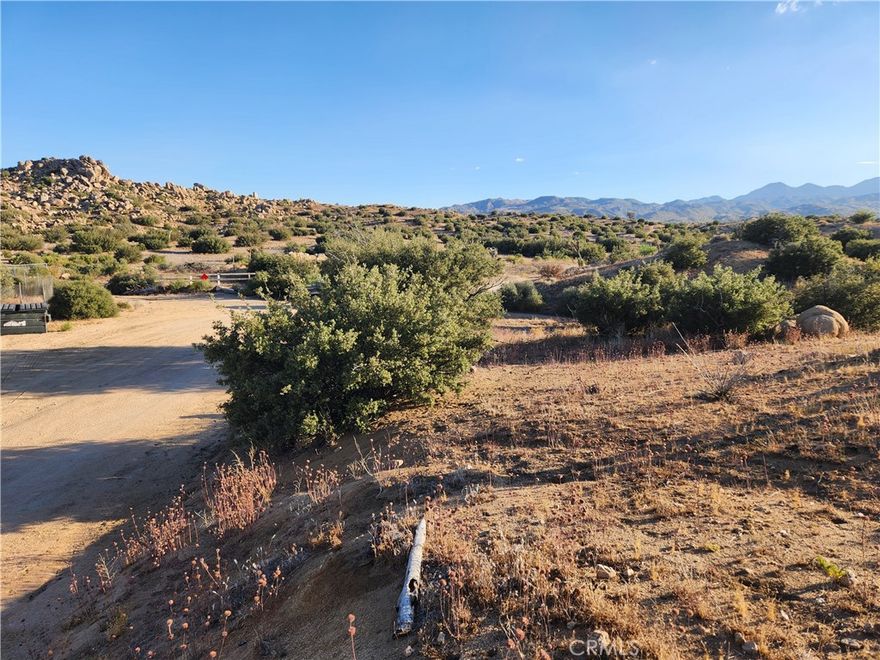 7.58 Acres (APN: 0593-134-03) GPS: 34.19143, -116.51680   This 7.58 acre lot is located in Pioneertown, CA. Pioneertown is in San Bernardino County 4 miles northwest of Yucca Valley, CA. This property is located in the Rural Living zone. In this area, you have a wide range of possibilities for land use. Whether you're interested in building a single-family home, setting up a manufactured home, starting a small farm, running a produce stand, or even hosting agritourism activities, the Rural Living zoning has you covered. You can also keep animals, operate a small livestock farm, open a school or place of worship, establish a park or playground, or even run a Bed & Breakfast or residential care facility. With such flexibility and opportunities, this property offers endless possibilities for your dream lifestyle or business venture.  Overhead electricity is approx 115 ft NE of the property. Residents have private water wells for their water needs, septic tanks for their sewer needs and propane tanks for their gas needs.  This property does not yet have an address. While the boundary lines on the map offer a glimpse, they are only approximate. A Buyer should verify boundaries, zoning and utilities, ensuring every aspect aligns with their vision for the property. Use address or GPS to locate GPS: 34.19143, -116.51680