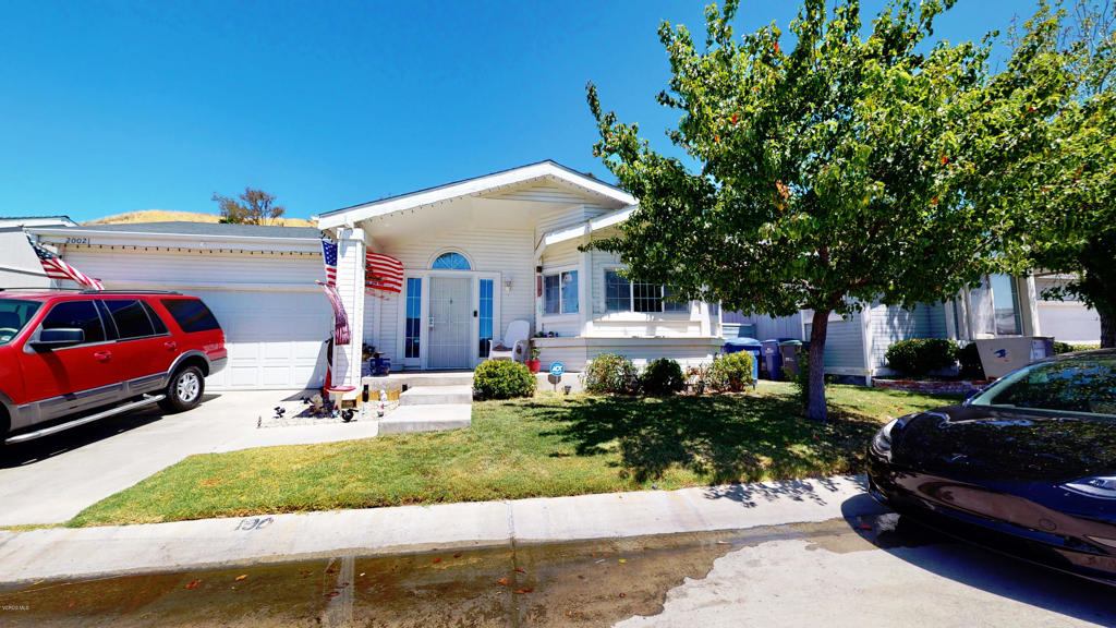 Canyon View Estates is a guarded, gated community just off Soledad Canyon Road. This home is one of the few that feature 4 bedrooms and 2 full bathrooms. Wood laminate floors throughout with carpet in the bedrooms. Large, open living room with access to backyard. Formal dining room with a convenient breakfast bar is great for those early morning breakfasts. Vaulted ceilings and open floor plan means you'll never feel cramped, and it has plenty of room to spare. With 4 bedrooms, the possibilities are endless. Convert the 4th bedroom to an office or a game room for the kids. No neighbors to the rear means quiet time in your backyard. Canyon View Estates features a Community Clubhouse, pools, spas, and a 24 hour Guard Shack. There are plenty of hiking and walking trails nearby and shopping centers are minutes away. A short drive and you're in Valencia, home to amusement parks and a wide variety of shopping areas.