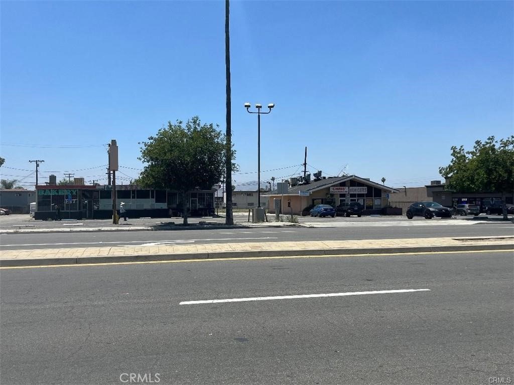 Property Overview:
This unique property comprises a flat, fully fenced 1.74-acre lot featuring two separate buildings, each with its own address: 407 Iowa Ave and 421 Iowa Ave.
407 Iowa Ave
A 2,152 sq ft standalone building currently leased and operating as a restaurant.
421 Iowa Ave
A 2,384 sq ft structure divided into two commercial units:
One previously used as a bakery
The other formerly operated as a barber shop
The lot is level throughout and enclosed with a common block wall, offering both security and privacy. With multiple established and potential income streams, this property presents a versatile opportunity for investors or owner-users alike.