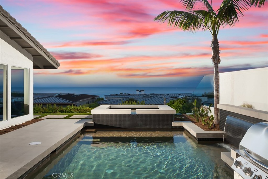 Located on one of the most premier panoramic ocean, Catalina and jetty facing view lots in Cameo Shores. 4533 Perham offers stunning views that can be enjoyed from nearly every room and center courtyard in this newly reimagined designer residence. An open floor plan invites guests to easily transition from the kitchen, family room, and outdoor living spaces highlighted by high-end finishes including French oak flooring, custom-milled cabinetry, and honed quartzite countertops. The gourmet kitchen is complete with chef-grade appliances, including a Wolf range, built-in espresso/coffee maker, and SubZero refrigerator. Oversized windows found in each room allow for an abundacne of natural light to flood every corner of the home, creating a tranquil ambiance complemented by the sound of crashing waves and the fragrance of ocean air. A gorgeous oversized walk-in closet is completed with a center island, custom built ins, and designer lighting fixtures reminiscent of the world’s finest showrooms. An oversized and private outdoor area that is rarely found but highly sought after in Cameo Shores allows for large scale celebrations and intimate gatherings alike - complete with pool & spa with matte glass designer tile, swim up bar, outdoor BBQ/kitchen area, outdoor dining loggia, and multiple seating areas. Residents of this exclusive enclave enjoy direct private access to Cameo Shores Beach.