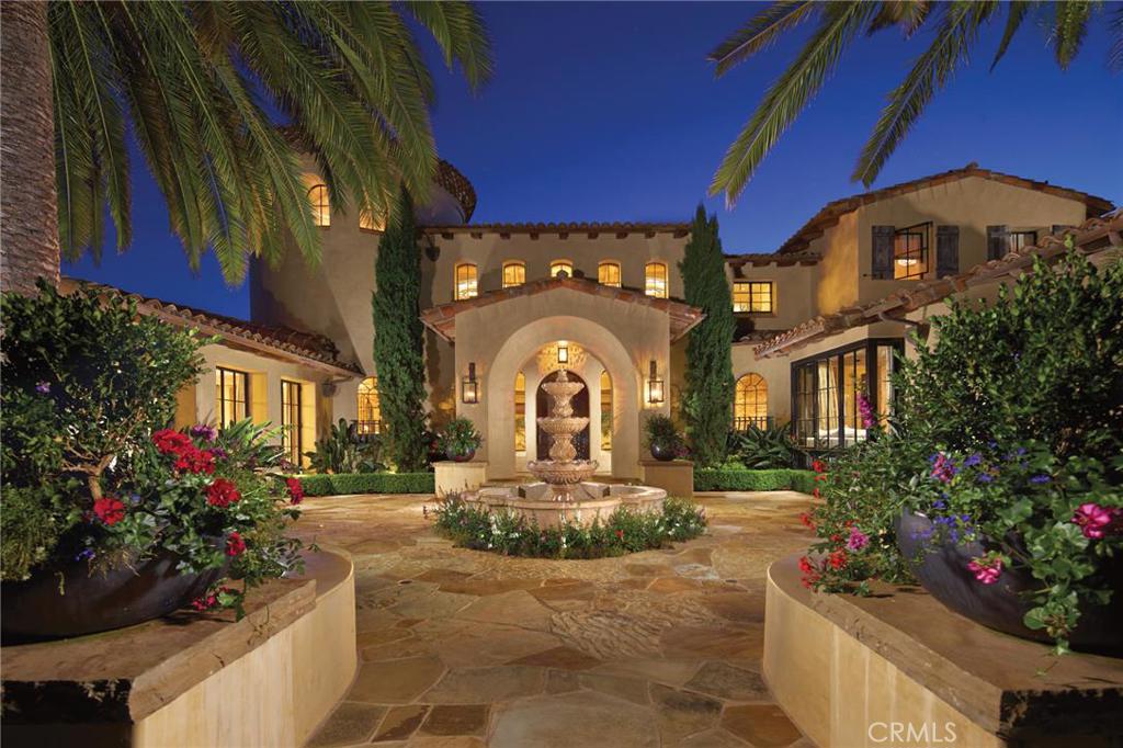 Situated in the hills of Shady Canyon, this custom built estate is nearly 10,000 square feet. The estate has a Spanish Colonial exterior. Enter the home through a private courtyard complete with a fountain and palm trees. As you cross the threshold of custom steel and glass doors, you step into an awe-inspiring two story foyer with views of the surrounding canyons and hills. There is main level master suite. The basement is designed as an entertaining space with a theater and game room, a full bar and wine room. In addition, there is a bedroom suite, beauty salon and subterranean garage on the lower level. Fine finishes can be seen throughout the home in the Obeche wood cabinetry, wide plank oak flooring and Venetian plaster. Enjoy spending the warm California evenings next to the pool and two spas. The outdoor space also contains a loggia with heated stone floors, a media center, an outdoor fireplace and full kitchen. The home has new AC installed and an AV security system with surveillance.