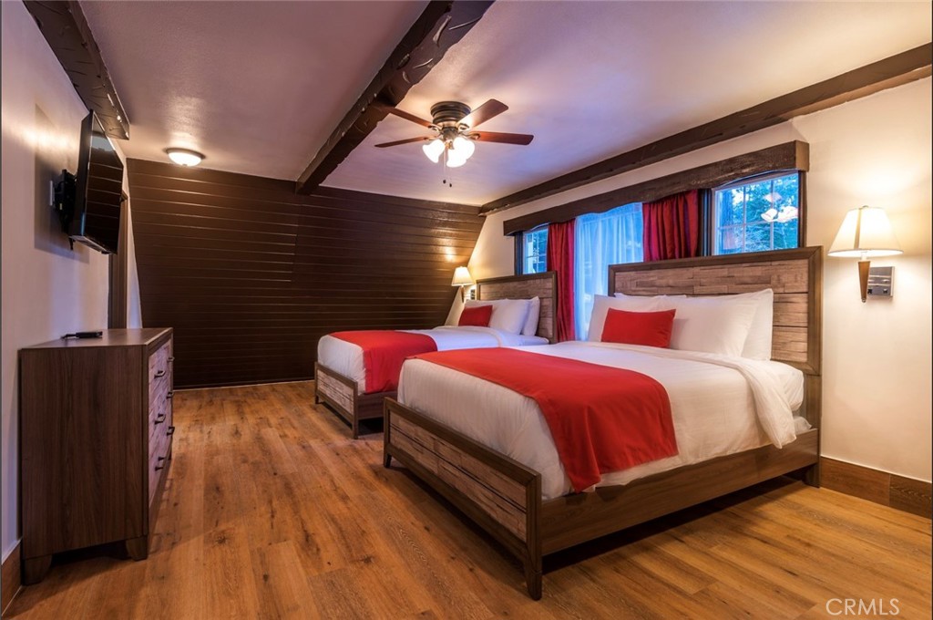 Tree Top Lodge presents a rare and extraordinary opportunity to own a property in the heart of Lake Arrowhead. This iconic 21-room lodge is set on over 2 acres of scenic land in the coveted Arrowhead Woods, offering lake rights and a prime location just before the entrance to Lake Arrowhead Village. Guests can enjoy the convenience of being within walking distance of the lake, shopping, dining, and entertainment, while also appreciating the tranquility of the surrounding natural beauty. The lodge features a mix of rooms and suites, including poolside accommodations, cozy deluxe rooms with fireplaces, and spacious suites ideal for large groups. The property boasts a heated swimming pool, a seasonal creek, and expansive outdoor spaces with a gazebo and stage—making it a perfect venue for weddings, corporate retreats, and special events. With excellent visibility and direct access to Highway 173, Tree Top Lodge enjoys prime positioning in a destination known for its upscale estates, vibrant nightlife, and year-round recreational activities, including hiking, fishing, boating, and skiing. Zoned as a motel (0331), the property offers exceptional potential for a hospitality business with significant growth opportunities. Additionally, nine units have been recently renovated, and the remaining rooms are in great condition, ensuring a comfortable and welcoming experience for guests.
The on-site wedding venue (has received 20 inquiries to book, although does need some repairs which owner is willing to give credit for the new buyer. Once renovated, there will extreme potential to become a sought-after destination for weddings and special events. Few miles down, is "Pine rose cabins" which is already booked out for wedding venues for 2 years in advance. With thoughtful enhancements, this venue could provide a significant new revenue stream, complementing the lodge’s existing business. Offering room rates ranging from $109 to $349 per night and with a well-established reputation, this turnkey property is primed to generate revenue. Financials will be available upon request. Seize this unique opportunity to own a piece of Lake Arrowhead history and create your legacy with the Tree Top Lodge.