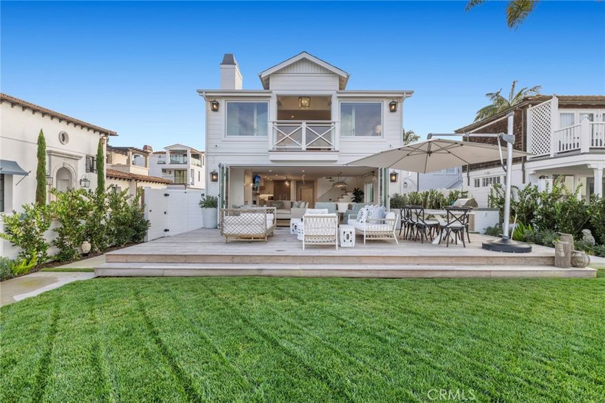 An iconic bayfront home on Peninsula Point. 1519 East Bay Ave. presents an extraordinary opportunity to acquire one of Newport’s most exceptional waterfront properties.
Occupying a 45-foot corner lot, this prized parcel boasts seamless indoor-outdoor living spaces, luxurious amenities, a private beach; as well as a private dock suitable for multiple yachts; two up to 57-feet and one up to 25’. 
Completed in 2022, the home takes full advantage of its north-facing position with virtually all rooms embracing city lights and harbor views.
Ideally configured for relaxed family living and large-scale entertaining, the vast open floor plan transitions seamlessly between inside and out with custom bi-fold doors that span the width of the home embracing the glorious views. 
An open plan kitchen is appointed with designer finishes including a La Cornue range, Thermador refrigerator, and a wine fridge. The kitchen also features a convenient butler's pantry, while the center island serves as both a dining and entertaining hub. In the living room, you'll discover tastefully crafted built-in cabinetry, perfectly complementing the fireplace that graces the living area.
The home is comprised of 4 en-suite bedrooms including an extravagant primary suite retreat with panoramic harbor views, high beamed ceilings, fireplace, and a designer bath with a freestanding tub, heated floors, and walk in shower. 
With prized boating facilities and direct frontage to Newport’s iconic harbor, this dream home is quiet and private, yet just moments from the Wedge, Balboa Island Ferry and world-class shopping and dining.