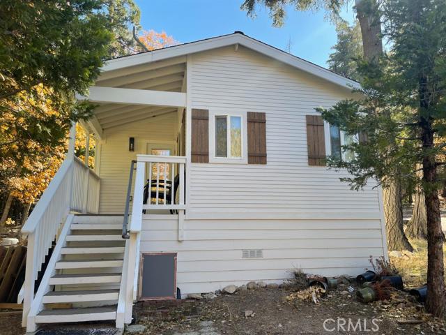 A must see adorable Cabin nestled in the trees. It sits on a large lot with level parking. It has been Lovingly updated. New paint, updated electrical. Kitchen has all new stainless appliances and professional gas burning stove,new quartz counter and tile kitchen as well as the bathroom with Pedestal sink. Large cement patio area for family and friend to gather or entertain. Come and see this little charmer before its gone.