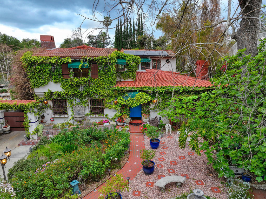 Welcome to Bacopa Villa, located in the coveted Altadena Country Club area. Built in 1930, this residence is a true work of art, crafted with the utmost attention to detail and exquisite architectural design. The beautiful tile entry welcomes you into formal rooms consisting of a quaint reception salon and beautiful skylight which bathes the entire space in natural light, formal living room with fireplace, formal dining room with fireplace. The family kitchen includes a breakfast/dining area and butler's pantry. There is a large family room for entertaining, and a nice-sized room which can be used as a study or home office. One of the many standout features of the home is the interior courtyard which provides a wonderful setting for alfresco dining.The second floor can be accessed by two staircases conveniently located on each side of the home. There are four bedrooms upstairs, two of the bedrooms have private bathrooms. There is also a generously sized laundry room. Additional highlights include red barrel tile roof, hardwood and tile floors, solar panels, mature fruit trees: Orange, Lemon, Kumquat, Avocado and Fig. Plenty of privacy both in the front and backyard. Lush greenery, mountain views, fountains, as well as a comprehensive security system which provides peace of mind. This spacious 11,703 square-foot lot offers ample potential for outdoor entertaining. The 2-car garage provides secure parking and storage. There is also additional driveway parking. Bacopa Villa offers a classic design with a Mediterranean flair that will make you feel like your miles away from the hustle and bustle and have been transported to the Mediterranean basin.