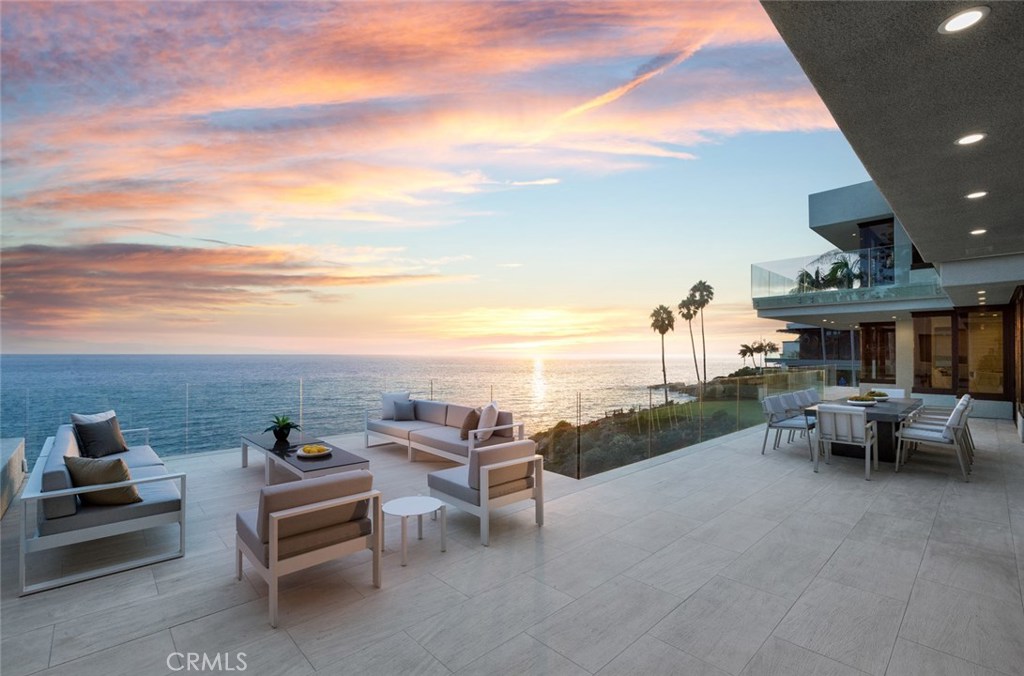 "Rockledge-By-The-Sea" is one of the most extraordinary oceanfront properties in Laguna Beach. Nearly an acre in size, the site includes 190' of ocean frontage, a scenic private access cove and beach, and extraordinary seaside gardens with a rolling lawn, pool and spa. After undergoing a two-year transformation, the newly expanded and reconstructed 10,000 square foot residence is complete. Light and bright, the contemporary architecture is designed to capture ocean and sunset views from every main room. The new master suite is nearly 3,000 square feet and occupies an entire floor with a private office, gym, spa and private sea view terraces. The main level was opened to create capacious living and entertaining areas – with astonishing views of the coastline. The family room opens through retractable doors to a sizable terrace with outdoor dining area set just above the cove. The finely detailed Bulthaup kitchen is complemented by a fully outfitted second ‘caterer’s’ kitchen. The lowest level includes three ocean view guest suites and an entertaining room. New amenities include a commercial 8-person elevator, a private double-gated north/south entry drive, and wine display room. This unique oceanfront property is sublime in every measure.