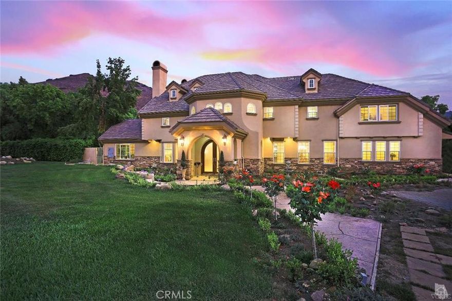 Santa Rosa Valley's Hidden Meadows equestrian friendly Estates. Expansive foyer with Versailles travertine,grand staircase of marble and wrought iron.Formal living room/fireplace. Entertainer's home with oversize granite island kitchen,custom wood cabinets, pot filler, 2 sinks, stainless Eletrolux appliances, and an over-size pantry. Breakfast nook, open family room/fireplace. Formal dining room. Downstairsbedroom/office/own bath plus powder room. Need a lift? We have an elevator to 2nd floor with 4 bedrooms/ensuite baths.Luxury Master Suite complete w/oversize walk-in closet,fireplace,jetted tub,bidet,travertine & balcony. Additional 700+ sq. feet storage in attic. Equestrian dream estate with direct access to miles of trails.ack room, lighted arena, aviary.Detached 4 car garage/workshop, fruit trees, gazebo, koi pond.Over 2 acres which has room for pool or tennis.