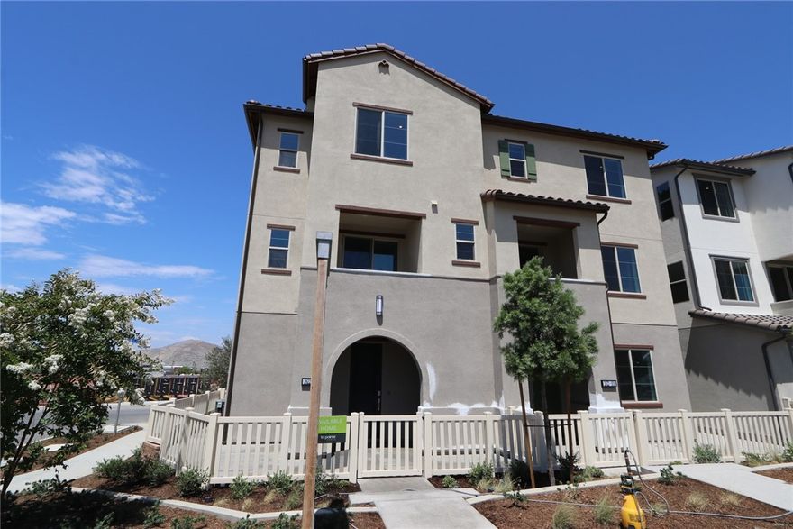 New Tri Pointe Homes Wyatt community in South Corona within gated Bedford. With a premium frontage/corner location looking out to the scenic Santa Ana Mountains, this paired Residence 1 duet home features lower HOA dues, an oversized fenced outdoor patio, 2 car attached garage with storage space, plus 3 Beds/2.5 Baths. The impressive Great Room/Dining/Kitchen area is complemented by a covered balcony that expands upon the outdoor/indoor dynamic and vistas. Designer-curated upgrades include satin white Shaker cabinetry w/ matte black pulls, polished "Simply Grey" kitchen Quartz, additional lighting, 12" x 24" tile flooring and upgraded textured carpet. Location also adjacent to upcoming pool with impressive Hudson House facilities and burgeoning Bedford Marketplace, Starbucks within walking distance. Transportation corridors (15, 91) also make all of the Inland Empire and Orange County accessible. Estimated August move-in.