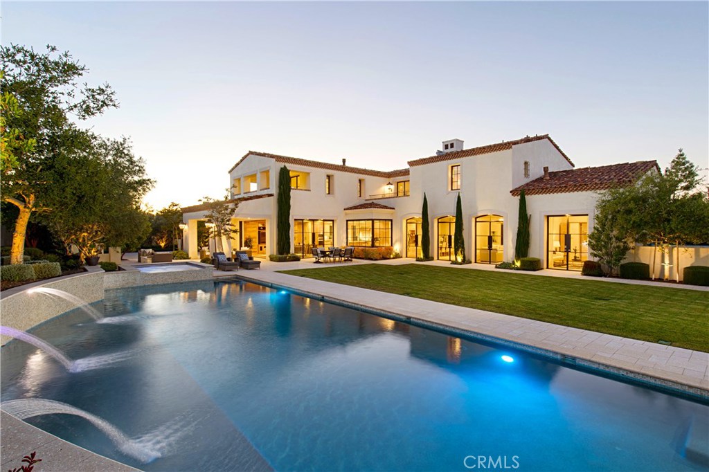 Experience the finest in comfort and luxury living in a newly built and upgraded 2014 Shady Canyon Estate Home on a hillside and quiet cul-de-sac in Orange County's most prestigious community. Behind the gates, walk or drive along winding roads with scenic and natural surroundings before arriving at your new French Provincial style exterior 9027 sf estate, nestled on an expansive 24,768 sf lot. The open floor plan, with 11 foot high ceilings, oversize Euroline steel windows, and sliding pocket doors provide spectacular canyon and private hillside views with no homes behind. Upon entering the custom estate, one is struck by the Contemporary, clean interior style. The floor plan gracefully encompasses an expansive yard with a luxury pool and spa. Enjoy 6 spacious bedrooms, 6 full baths and 4 half baths, a 4-car garage, gated motor court , separate guest casita, Home Theater, Tower Loft, and Great Room. The large Gourmet Kitchen and separate Prep kitchen and Family Room connect to an outdoor California Room. A main-level next-gen master suite opens directly to the back yard garden. The Master Suite includes a private covered deck, master bath, and large walk-in closet. Designer reclaimed white oak hardwood floors, Custom Counters and Cabinets, Designer Appliances, 40LG panel Solar System, Control-4 SMART home technology system. 24 hour guarded security. Only minutes from the beach, Tom Fazio-designed 18 hole golf course, airport, freeways, and world-class shopping and dining.