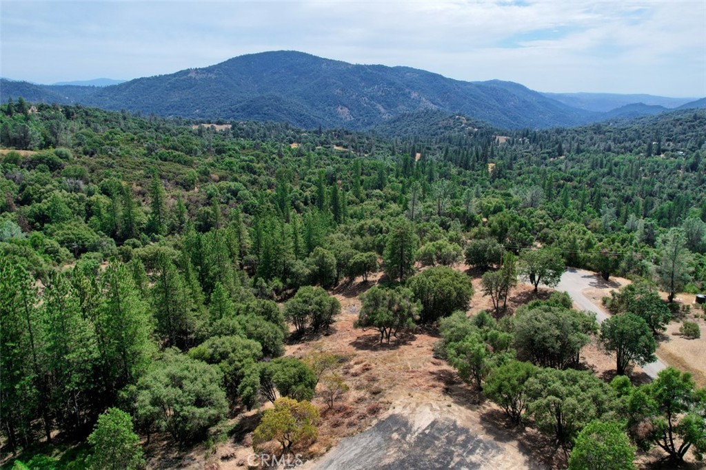 Incredible opportunity! 20.9 pristine acres, freshly brushed, boasting multiple building sites. This gem comes with a capped well, a robust producer when drilled at 36 Gallons Per Minute.
The views? Simply breathtaking. Feast your eyes on Miami Mountain while you contemplate your dream home amidst the beauty of Oak and Ponderosa Pines, graced with the charm of Manzanita.
Elevated at approximately 3100 feet, you'll enjoy the perfect blend of serenity and accessibility. Whether you're craving adventure in the Sierra National Forest, just a stone's throw away, or a quick 20-minute jaunt to the vibrant hubs of Oakhurst or downtown Mariposa, this location offers it all.
Are you bursting with ideas for your dream home? Well, this is the canvas you've been waiting for. Bring your blueprints, your imagination, and let your creative juices flow! This is your chance to turn your vision into reality. Don't miss out on this golden opportunity to create the lifestyle you've always dreamed of.
Land Use Restrictions ... Inter County Title shared there are no restrictions pertaining to the land other than the documents located in the supplement section.