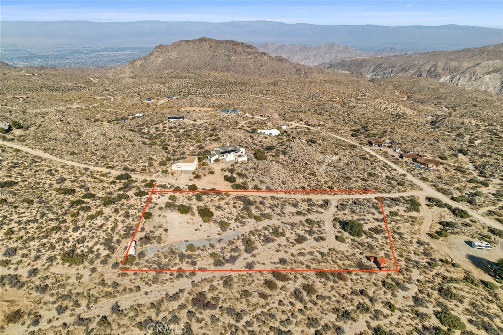 Investment Opportunity in Chapman Ranchos: Rare 2.36-Acre Property with Exceptional Potential Don't miss out on this rare investment opportunity--2.36 acres of prime land in the coveted Chapman Ranchos. This property offers a unique blend of rural tranquility and proximity to Southern California's most prestigious attractions. Ideal for building your dream home or a lucrative rental property, this land is set in a region that continues to grow in value.The seller has taken key steps to prepare the property, including a comprehensive survey completed in 2022, ensuring clear and accurate land boundaries. Included are two 5,000-gallon water tanks, strategically placed with hose bibs at various points across the property, providing easy water access. Additionally, the property features underground electrical infrastructure, making it ready for immediate development. A 10 x 10 storage unit is also present, that does not require a permit based on the square footage. A standout feature of this property is the absence of an HOA. Enjoy four distinct seasons while being just a 15 min drive from South Palm Desert's world-class golf resorts, the renowned Coachella Festival, the BNP Paribas Open in Indian Wells, & a variety of equestrian events. Nearby, El Paseo offers luxury shopping and 5-star dining.As the region continues to develop, properties like this are increasingly rare, making it a valuable investment.