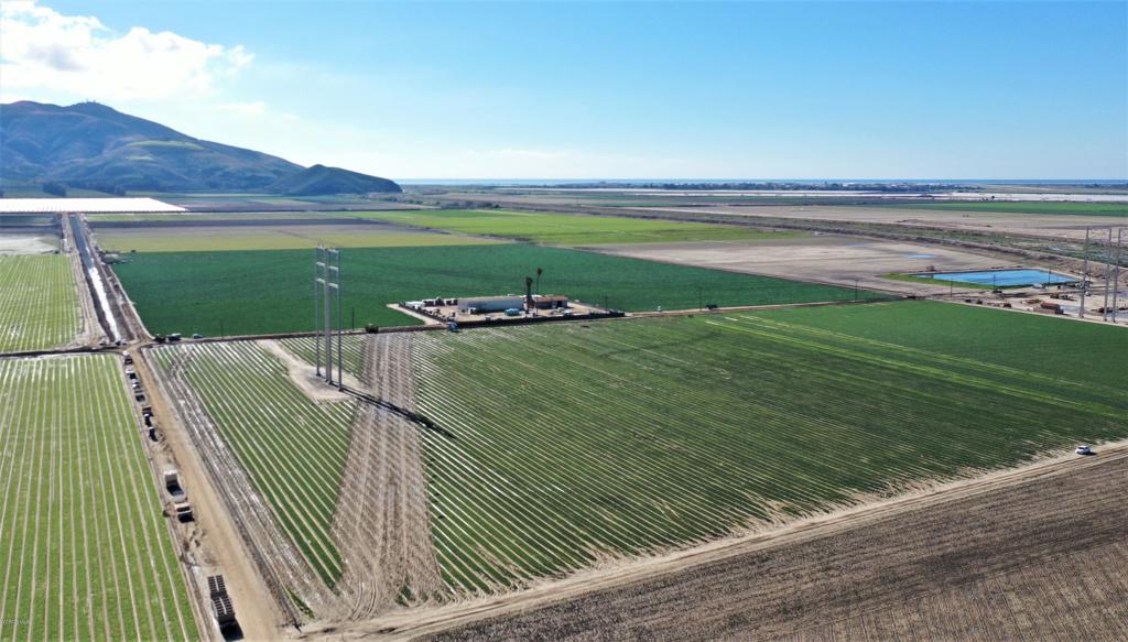 Round Mountain Ranch - 367.68 +/- Acres of Prime Ventura County Farmland on the Camarillo/Oxnard Plain with 316 gross farmable acres. Located on West Potrero Rd, south of the Intersection of Potrero, Hueneme & Lewis Roads, adjacent to Calleguas Creek & near Hwy 1 & the 101 Fwy. Comprised of 5 Parcels Plus added Benefit of SCE License Agreement for an additional 26 farmable acres (SCE license currently w/ Tenant). 2 Water Sources: Private Onsite Well pumping 1,118+/- GPM & Pleasant Valley County Water District water.Portions of the ranch are Tiled. Improved with two Equipment Sheds (1 large & 1 small).Sale is subject to a Farm Lease expiring 7/31/22.Zoned AE 40 Acre Minimum & Subject to Ventura County SOAR. AP #s 230-0-180-220 (174.3 Acs), -095 (52.21 Acs), -200 (70.47 Acs), -210 (70.47 Acs), & -070 (10,000 sf) totaling 367.68 gross acres.
