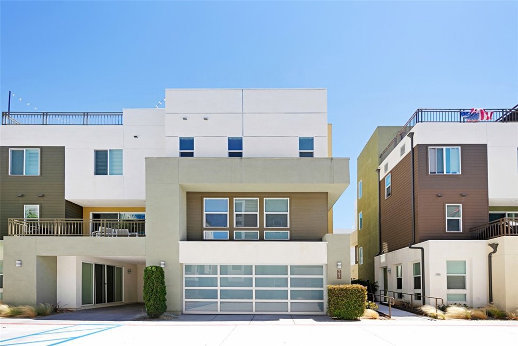 This rare model 3 residence is a one-of-a-kind open-concept unit and is located within a very desirable location within The Boatyard boasting incredible views. This three-story home with rooftop deck features modern architecture, design, and interior elements with abundant upgrades, including wood-like porcelain tile flooring, quartz countertops, porcelain subway tile backsplash, stainless-steel appliances and designer elements such as custom window coverings and light fixtures. The versatile first floor is legally-permitted and ADA-compliant for small business use. Offering dual primary suites, walk-in closets, each with en-suite bathrooms with floor-to-ceiling porcelain showers and frameless door and panel glass enclosures. Entertain among sunsets and panoramic city views from the rooftop deck or second-floor balcony. Ample parking is available with a two-car garage as well as a private covered carport. Close to local dining and shopping on 17th Street, Fashion Island and from the world-famous Balboa and Lido Peninsula. Also offers convenient access to the 55/405 freeways, 73 toll road, and Pacific Coast Highway, as well as John Wayne Airport.