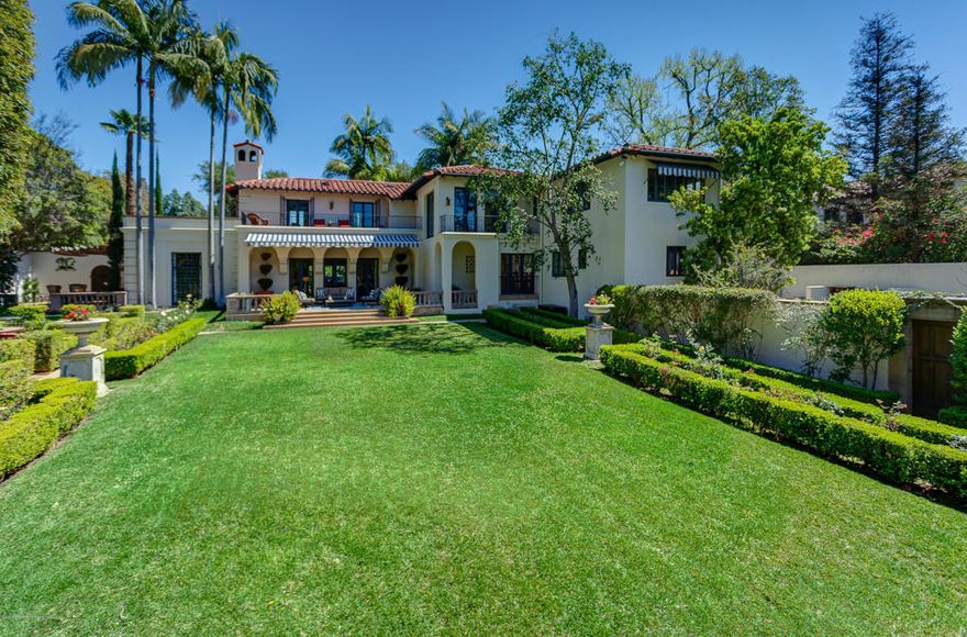 A seamless blend of old world charm and modern sophisticated living, this exquisite 1924 Italian Revival estate, known as Villa delle Favole, graciously rests on over 1 acre of flat land on one of San Marino's most revered streets...Oak Grove Avenue. Designed by Pasadena architect Clarence L. Jay, this home features numerous original character details including a stunning boxwood parterre garden as well as a dramatic Library with wall of leaded glass windows and Batchelder tile fireplace. This home has undergone several extensive renovations over the years including those by world renowned designer Matthew White who is on Architectural Digest's list of the world's finest designers and includes a new Cynthia Bennett & Associates designed gourmet Kitchen and a newly reimagined sparkling swimming pool & spa with outdoor kitchen and sundeck. Entertain and host guests in the detached 1,200 Sq. Ft. Guest House that boasts a Living Room, spacious bedroom, full Kitchen, and bathroom with steam shower. This home truly offers everything you are seeking in a character estate home in one of Southern California's most treasured communities. All of this and more....in the nationally renowned and award-winning San Marino Unified School District.