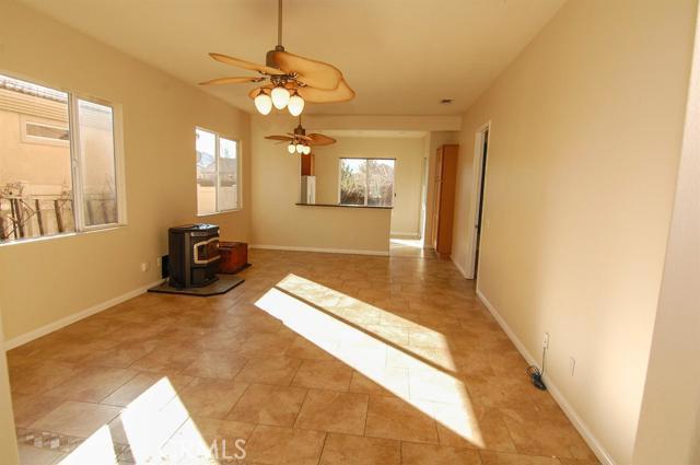Located in the prestigious community of Sun City & Del Webb of Apple Valley. Sun City is a community of 55+. This property is sharp and clean and has been updated with custom tile, new carpet and fresh paint throughout. This home offers a bright and open living area with pellet fireplace and semi private sitting area. The sunny kitchen has plenty of hardwood cabinetry, Corian counter tops and breakfast bar. Other features that you will enjoy: indoor laundry, plenty of cabinetry for storage and two-car finish garage with storage cabinets. Backyard has a park like setting with arbors, brick paths and a good size covered patio. Included in the community is the expansive clubhouse, 3 beautiful pools, spa and hot, tennis and gym. # of RV Spaces: 0 Special Features: PTRY,POOL,CLUB,SPA,TENN,GYM,OSM Lot Location Type: Standard Location Special Features: Underground Util: # of Attached Spaces: 2 # of Detached Spaces: 0