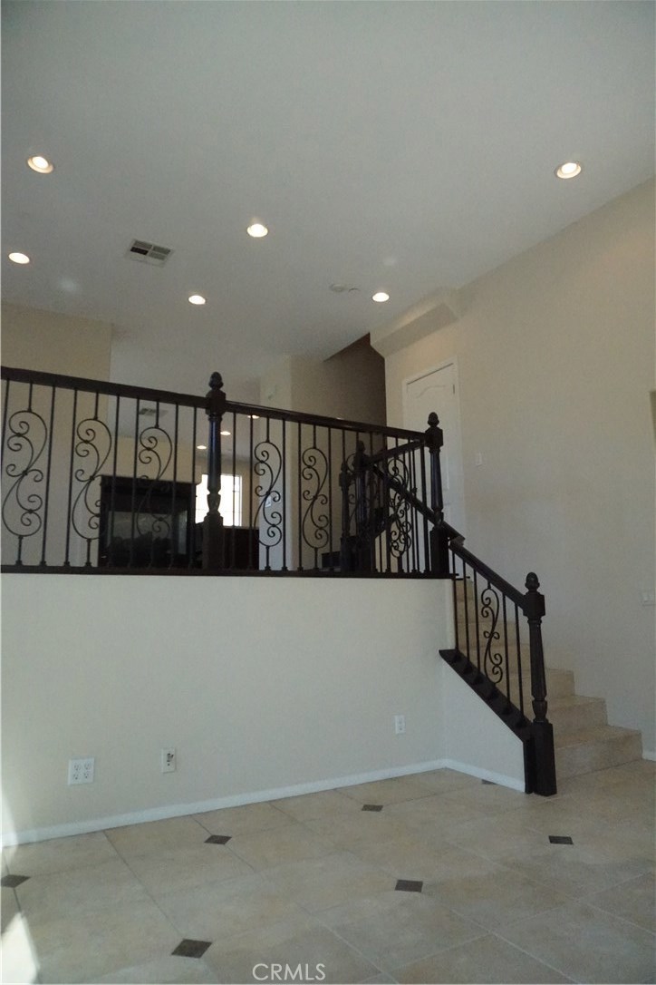 Set atop the exclusive gated community of Tremont is this newly remodeled home ready for you to move into. The 3 bedroom, 2.5 bath home features new interior paint, new modern countertops, new sinks, and newly installed premium wood-like laminate flooring. Facing the front of the home, you will be greeted by a lovely front porch. As you walk into the home, you will enjoy the natural lighting filling the open concept vaulted ceilings of the formal living area. Up the steps is the formal dining area which is warmed by the wrap around fireplace that leads into the expansive family room. Adjacent to the family room is the large kitchen that boasts a huge island perfect for preparing meals while entertaining guests. As you head upstairs, you will end at the landing hallway next to the master's bedroom. The master's bedroom features a large two door walk-in closet and the master's bathroom has brand new dual sinks, a relaxing tub, a spacious shower, and a separate toilet area. Across the hallway are two bedrooms that are next to the upstairs bathroom and laundry room. There is also a 0.5 bathroom located downstairs near the front entrance. The home features a 2 car garage. The Tremont community boasts a private park with grilling area for use by its homeowners. The home is served by one of the best and highly desirable schools in the whole county. Come by and see that this is your new home.