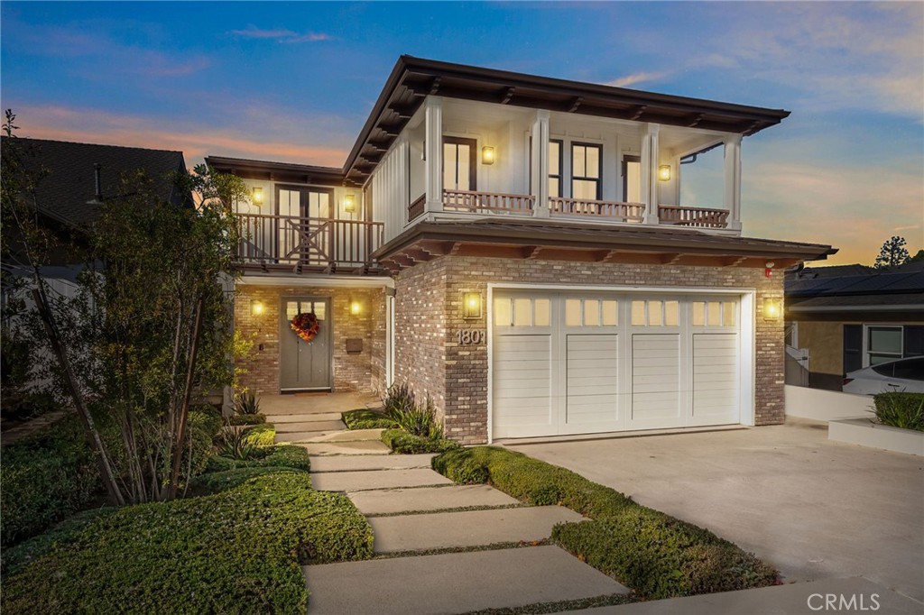 Welcome to 1801 Oak Avenue, a stylish contemporary coastal home featuring six bedrooms and four-and-a-half baths in 5370 square feet of refined living space. Built in 2019 on a 4482 square foot lot, this home offers a harmonious blend of sleek design and cutting-edge technology with the tranquility of coastal living. The open living room features high, beamed ceilings and a striking fireplace wall, making for a sophisticated yet relaxed atmosphere. Folding accordion doors open onto the private yard and patio, creating a fusion of seamless indoor/outdoor living. Al fresco dining and entertaining are a breeze with the built-in Lynx barbecue and prep area, and a turf yard makes for no-fuss maintenance. Chefs will appreciate the stunning kitchen, anchored by a large island with seating for six and offering a SubZero fridge and Wolf, Miele, and Bosch appliances as well as a built-in desk, wet bar, and a cozy breakfast nook. The formal dining room provides an ideal place to entertain or enjoy a leisurely meal at home. Upstairs, the Primary suite is a true sanctuary and features a fireplace, private deck, walk-in closet, and beautiful, spa-like bath with steam shower and soaking tub. Three additional bedrooms and three full baths, as well as a convenient laundry room with sink and custom cabinetry complete the second floor. The finished basement is a haven for relaxing and entertaining and comes complete with a family room, a full-sized wet bar with wine fridge, ice maker and dishwasher, a bedroom and full bath, an office, a home theater, and a 1000+ bottle wine cellar. An elevator and spacious three-car garage, as well as hardwood floors throughout and a thoughtfully integrated Smart Home system are just a few of the amenities found at this beautifully designed, custom home. Perfectly positioned in the highly sought-after tree section of Manhattan Beach, this residence is close to area boutiques, lifestyle amenities, and top-rated restaurants as well as local schools and parks. Enjoy the best of both worlds – a serene and stylish atmosphere not far from the vibrant energy of one of the best beach towns in Southern California.