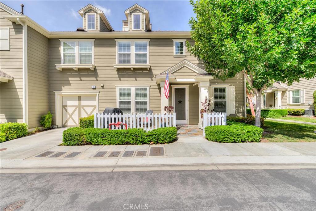 Beautiful, two story townhome with dual master suites. Home features gorgeous hardwood flooring, designer porcelain tile, custom stone flooring, custom paint and custom window treatments including plantation shutters. Open kitchen with adjacent dining room features stainless steel refrigerator and walk-in pantry plus generous cabinet and counter space. Tastefully upgraded throughout, this home also includes washer & dryer in separate interior laundry room. Enclosed front porch with patio furniture and barbeque. Wonderful location in the center of Ladera Ranch - close to shopping, restaurants, schools and community amenities.