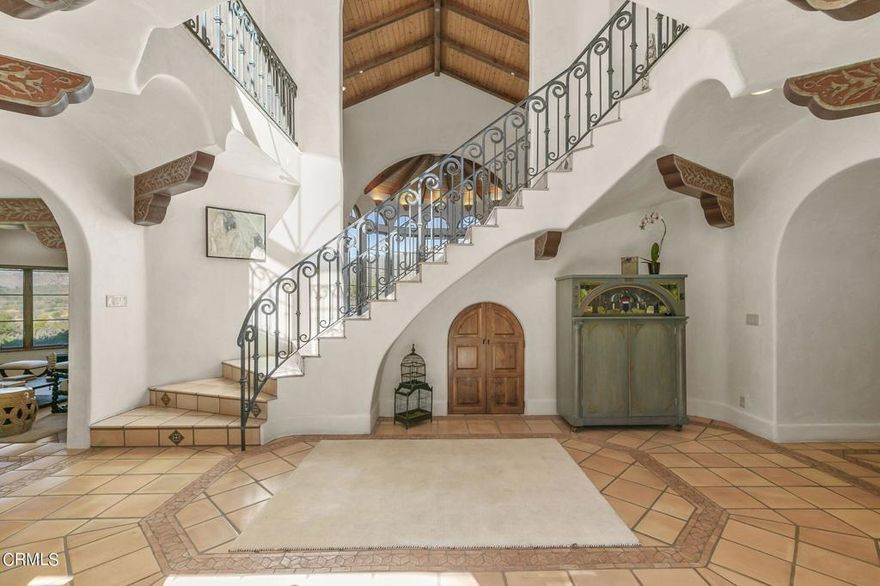 We welcome you to step back in time and savor the peace and solitude of casual yet refined ranch living. Approximately 1-1.5 hours from LA and an hour from Montecito, with uninterrupted views of the majestic mountains in all directions. You will find yourself one with the clouds, transfixed by the seasonally snow capped mountains or warmed by the sunlit scenery. With approx. 31+ acres of land the property hosts a 5,370 sf main house, guest house, covered parking for 14+ cars, two barns, corrals, stalls & tack rooms, a well, and 2 seasonal creeks. The main residence's fluid architectural design is a masterpiece designed by the acclaimed Marc Whitman showcasing floor to ceiling windows, coved ceilings, hand carved beams, wood ceilings, & an abundance of French doors allowing for indoor/outdoor living. Meander down to the 3,000 sf barn which is the perfect place to house your collection or explore a new hobby! Gentle rolling hills along with the wild hillside make this a rarity in the Ojai Valley. Sit back and soak in nature at its finest with soaring hawks & native vegetation. In the heart of the home is a courtyard enticing you to relax & savor life with a renewed sense of gratitude. This exceptional property embodies the essence of Ojai with unrivaled tranquility & natural beauty! The perfect sanctuary for your weekend getaway or full time living.