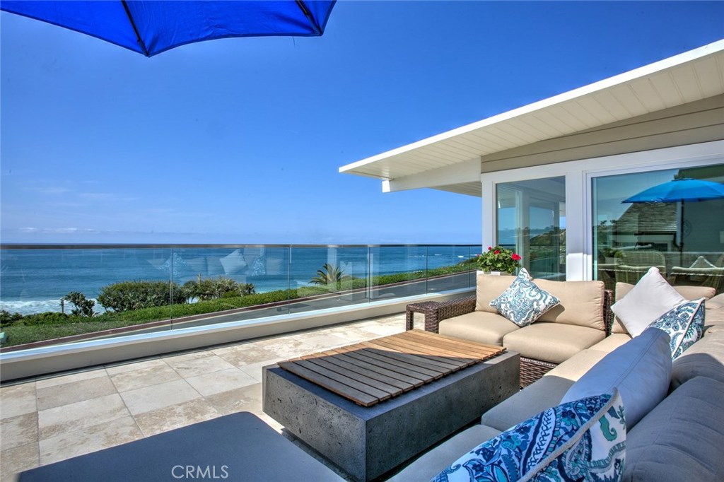337 Monarch Bay Drive is almost an ocean fronting home located in the gated beach community of "Monarch Bay" in Dana Point, California. This "Front Row Home" is located on fee simple land with expansive ocean views. The soft contemporary home includes 5 bedrooms, 5 bathrooms, an expansive ocean facing deck, large ocean view entertainment room. The colors and tones of the masterpiece allows endless viewing of the different phases of the sun over the ocean. The sunrise views from the East over the Ritz Carlton Hotel to Catalina Island Sunsets change everyday. The communities private beach club is operated and managed by the Monarch Beach Resort Hotel which includes beach towels, chaise lounges and umbrella service. The Club offers various food services from fine dining to casual BBQ meals on the outside patio. This Club House is a short distance across the street and down the stairs to the ocean front Clubhouse with all of its benefits.