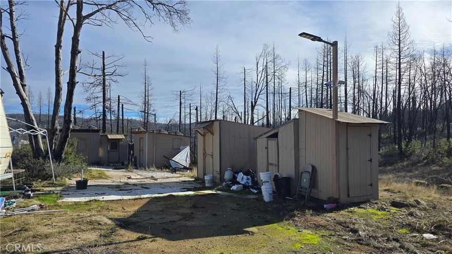 5.5-Acre Private Property with Stunning Views
Discover the ultimate in privacy and serenity with this expansive 5.5-acre property, nestled at the top of a hillside with sweeping, panoramic views of Bald Rock. Surrounded by a fully fenced perimeter, this secluded property offers an off-grid lifestyle with modern amenities, including a well and septic system.
Several functional outbuildings provide ample storage space, all powered by solar energy with battery backup for added independence. The property is equipped with an irrigation system, and underground power is accessible at the front gate, offering the potential to connect to the grid if desired.
Property is in need of a good cleanup but could provide sustainable living. Trailer is included in the sale