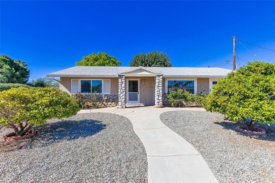 WOW THIS ONE WILL NOT LAST!! Sun City Senior Community this two Bedrooms / one Bathroom, Light and Bright home with Central A/C. Beautiful Wood Floors throughout. The Kitchen has Granite countertops & Granite backsplash and plenty of cabinet space. Newer central heating and air conditioning newer windows, Indoor Laundry Room with Direct Backyard Access. Attached 1 car garage with Direct Access into home. The Lovely Backyard has Great Landscaping with many fruit trees, also with access to SCCA's unparalleled amenities, including an indoor tournament shuffleboard court, horseshoe pits, fitness center, pools, spa, and lawn bowling, the opportunities for recreation and socializing are endless. Information taking from the Sun City website. Embrace the active 55+ adult lifestyle that Sun City is renowned for, where every day brings new adventures and opportunities for fun and relaxation. Make the most of your retirement years in this charming Sun City home.